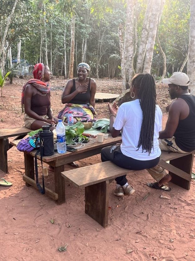 Guests enjoying organic farm-to-table meal in outdoor setting